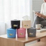 Aroni Household Decorative Round Plastic Tissue Box in black and white on a wooden table.