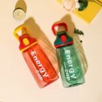 Stay hydrated in style with the all-new Energy Cup 750ml Water Bottle, designed for daily use whether you're at school, the gym, office, or on-the-go. Made with high-quality BPA-Free plastic, this lightweight bottle features a secure flip-lock cap that prevents leaks and spills – perfect for your backpack or gym bag. The sleek design and trendy colors make it a favorite among boys, girls, teens, and fitness lovers. Ideal for both hot and cold drinks, this durable bottle is easy to clean and comfortable to carry. A must-have for students, professionals, and athletes who want to drink water the smart way!