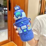 Colorful kids water bottles with cute googly eyes and "Lovely" label, featuring BPA-free plastic and flip-top straw lids – perfect for toddlers and school use.