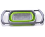 Green and grey collapsible silicone colander with quick drain holes, perfect for washing fruits, vegetables, and pasta in the kitchen.