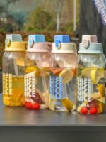 "Portable water bottle with handle and straw, 1700ml or 2000ml capacity, ideal for sports and travel"