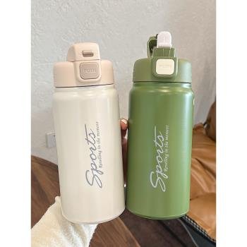 Two stylish sports water bottles in beige and green color with flip lock lid design, ideal for gym and daily hydration