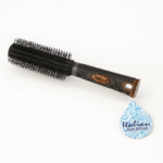 A black round hair brush labeled "Valian" with dense bristles, a textured anti-slip handle, and a branded blue tag reading “Valian Hair Brush