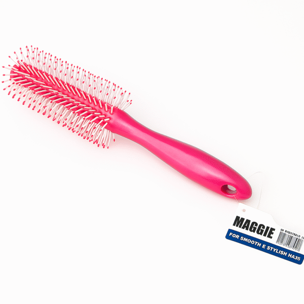 A pink paddle-style Maggie hair brush with white bristles and red tips, attached to a product tag reading “For Smooth & Stylish Hairs.”