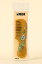 Packaged Maggie wooden comb with hand-painted blue and white floral design, anti-static fine teeth, and ergonomic handl