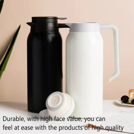 "1.5L black and white vacuum thermal jugs with ergonomic handles and leak-proof lids – ideal for hot and cold beverages"