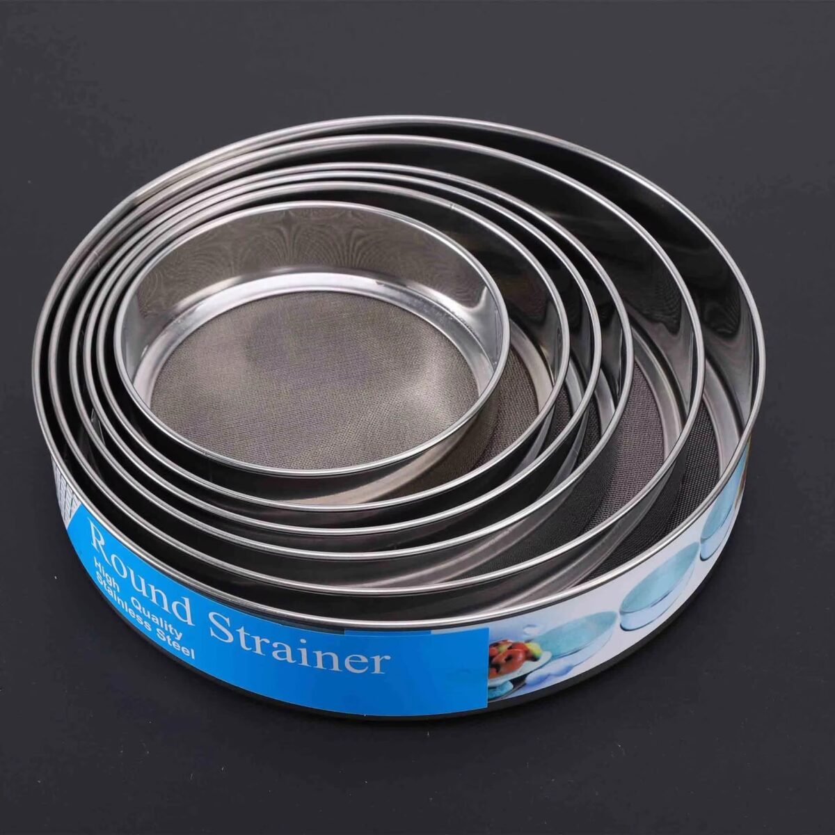 6-piece round stainless steel mesh strainer set in different sizes arranged together on a dark background