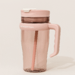 Close-up of flip-open straw lid on pink water tumbler