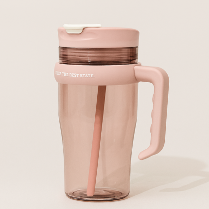 Close-up of flip-open straw lid on pink water tumbler