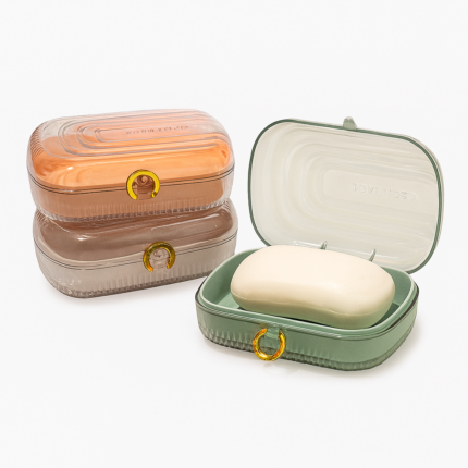 3-piece leakproof travel soap case set with lid and drain tray – green, amber, and mocha colored plastic soap boxes with secure gold closure rings for bathroom or travel use