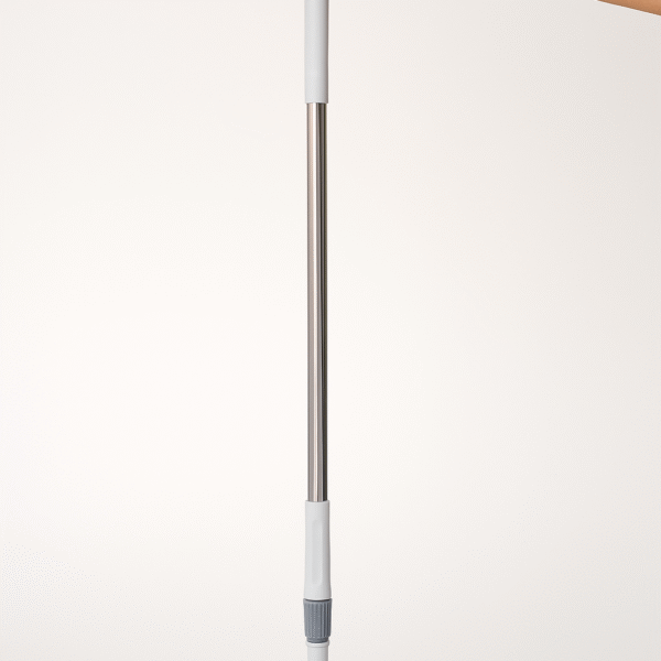 2-in-1 adjustable floor scrub brush with long handle held vertically by hand