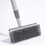 Close-up of heavy-duty bristles and squeegee on 2-in-1 bathroom cleaning brush