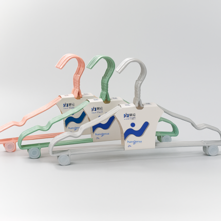 stainless steel clothes hangers in pastel shades with bottom bars and rotating hooks for organized wardrobe storage"