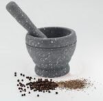 "Granite mortar and pestle set in 5.5 and 4.5 inch sizes for grinding herbs and spices"