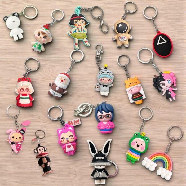 "Colorful multi-character cartoon key ring with cute figures attached to a metal keychain loop"
