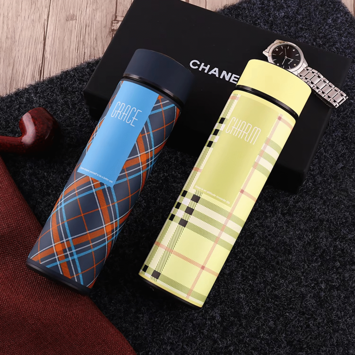 Four stylish smart LED thermos bottles in plaid designs with digital temperature displays showing 28°C, labeled GRACE, LIVELY, SWEET, and CHAR