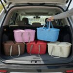 Family picnic using various colored Universal Carry Basket organizers in an outdoor setting.