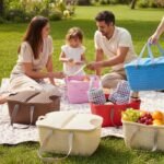 Family picnic using various colored Universal Carry Basket organizers in an outdoor setting.