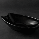 Black melamine serving tray filled with cooked pasta, displayed on a dark background — modern and elegant food-grade melamine tableware ideal for restaurants, cafes, and home dining in Pakistan.