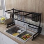 Black 1-layer kitchen sink rack, 33-inch long plate rack dish drainer for spacious sink organization in Pakistan.