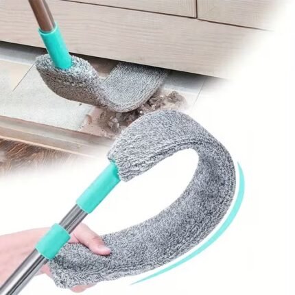 Flexible bendable flat microfiber mop cleaning under the bed and sofa in a Pakistan home