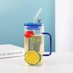 400ml square glass juice cup with colored handles and straws, durable household kitchen accessories available for wholesale rate in Pakistan.