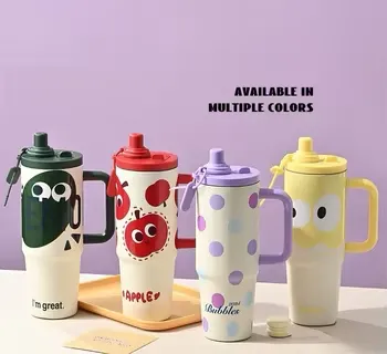 900ml-tumbler-bottle-straw-handle-cute-designs-pakistan.jpg Four 900ml aesthetic tumbler water bottles with straw lids and side handles in four cartoon designs: purple polka dots, red apple, dark green character, and yellow smiley face displayed on a purple background